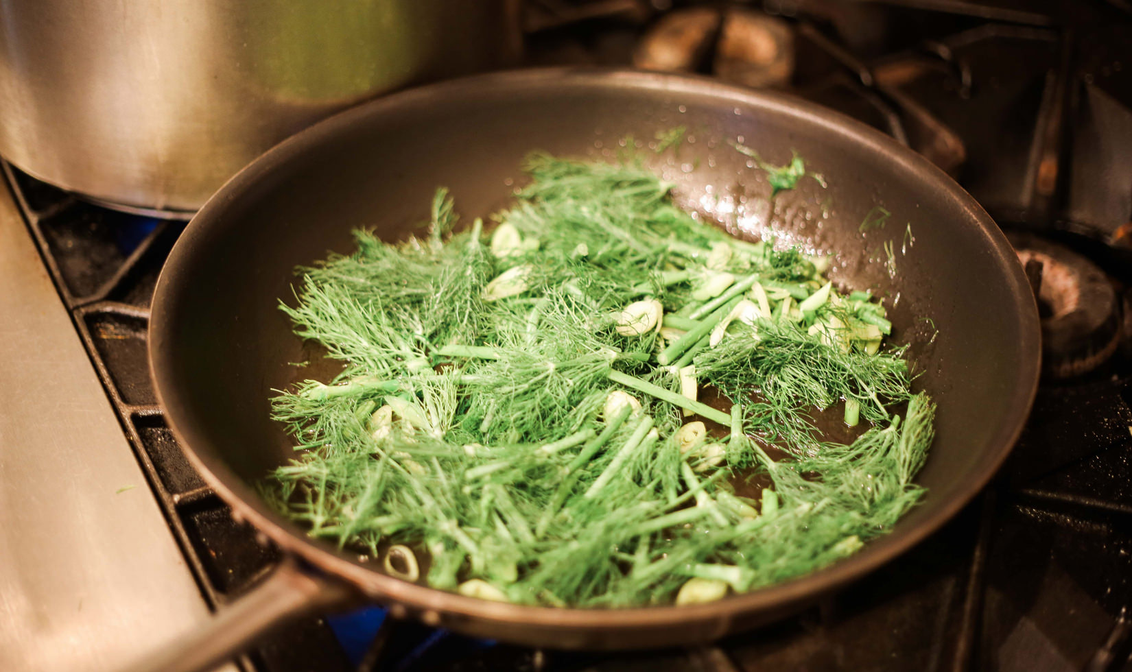 stir frying the herbs 