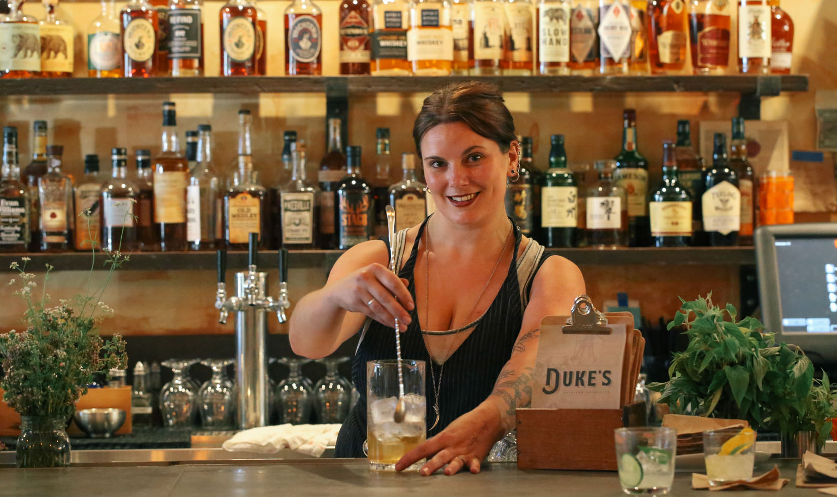 Duke's Healdsburg bar owner stirring cocktails