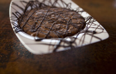 close up of Jordan Winery Easy Chocolate Mousse with dark chocolate drizzle