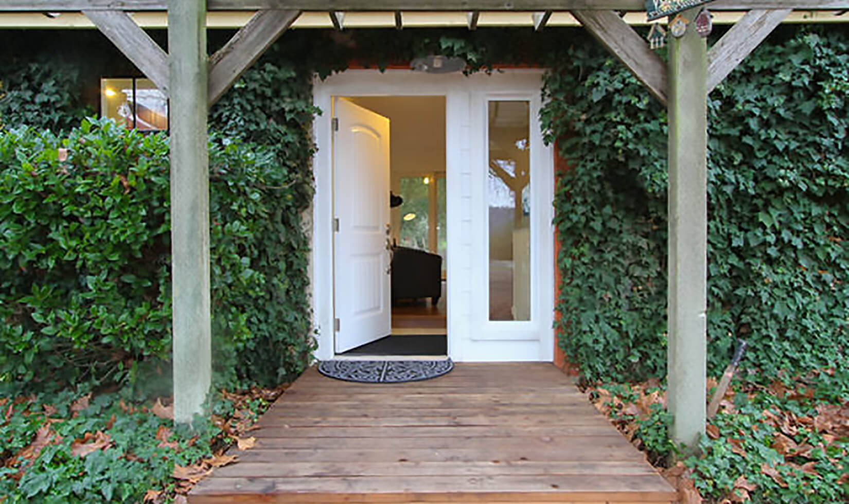 Welcoming front porch at Enriquez Estate’s secluded two-bedroom cottage in the vineyard.
