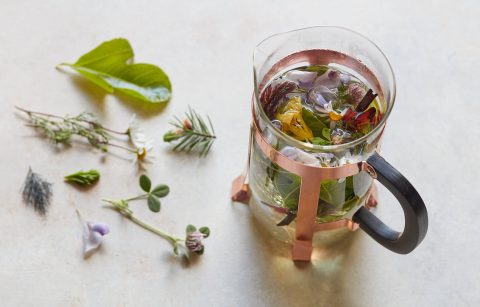 Jordan Winery Nasturtium tea in tea press with additional ingredients laid out.