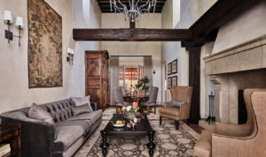 Jordan suite living room with elegant furniture and wooden beam across ceiling