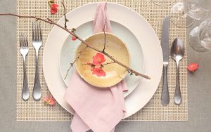 spring dinner table place setting with cherry blossoms