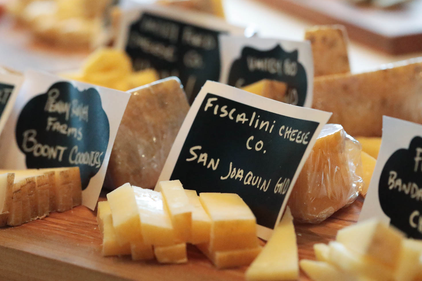 Pieces of Fiscalini Cheese Co's San Joaquin Gold cheese cut for tasting.