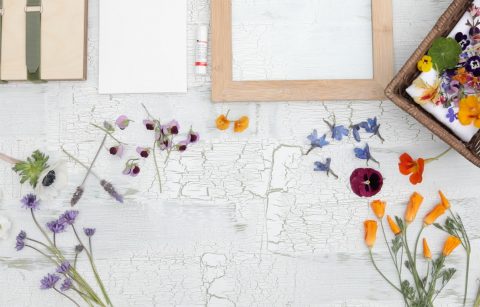 an assortment of wildflowers from Jordan Winery property on table with some pressing tools