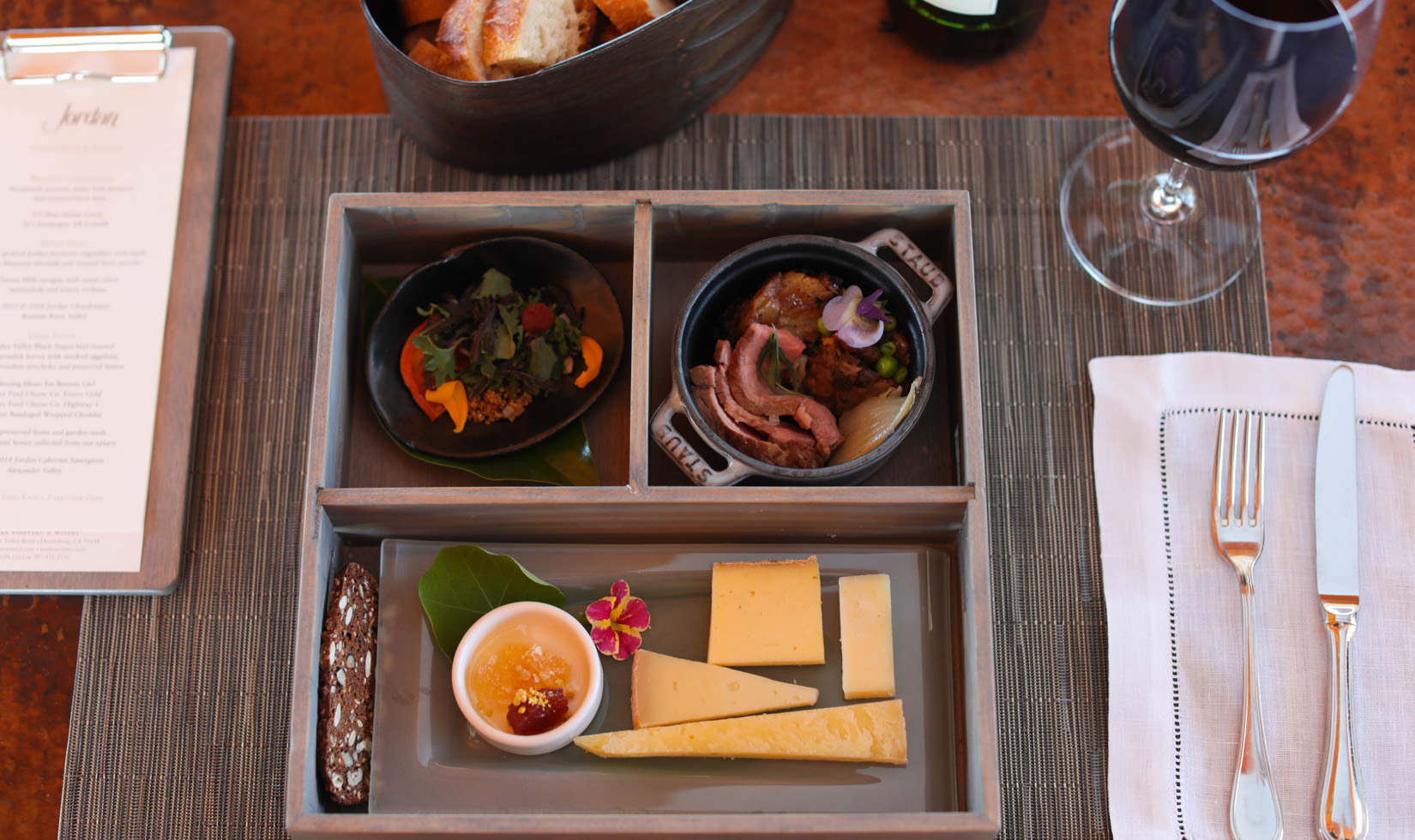 Jordan Winery bento box with artisan cheeses and multiple vintages of Cabernet Sauvignon