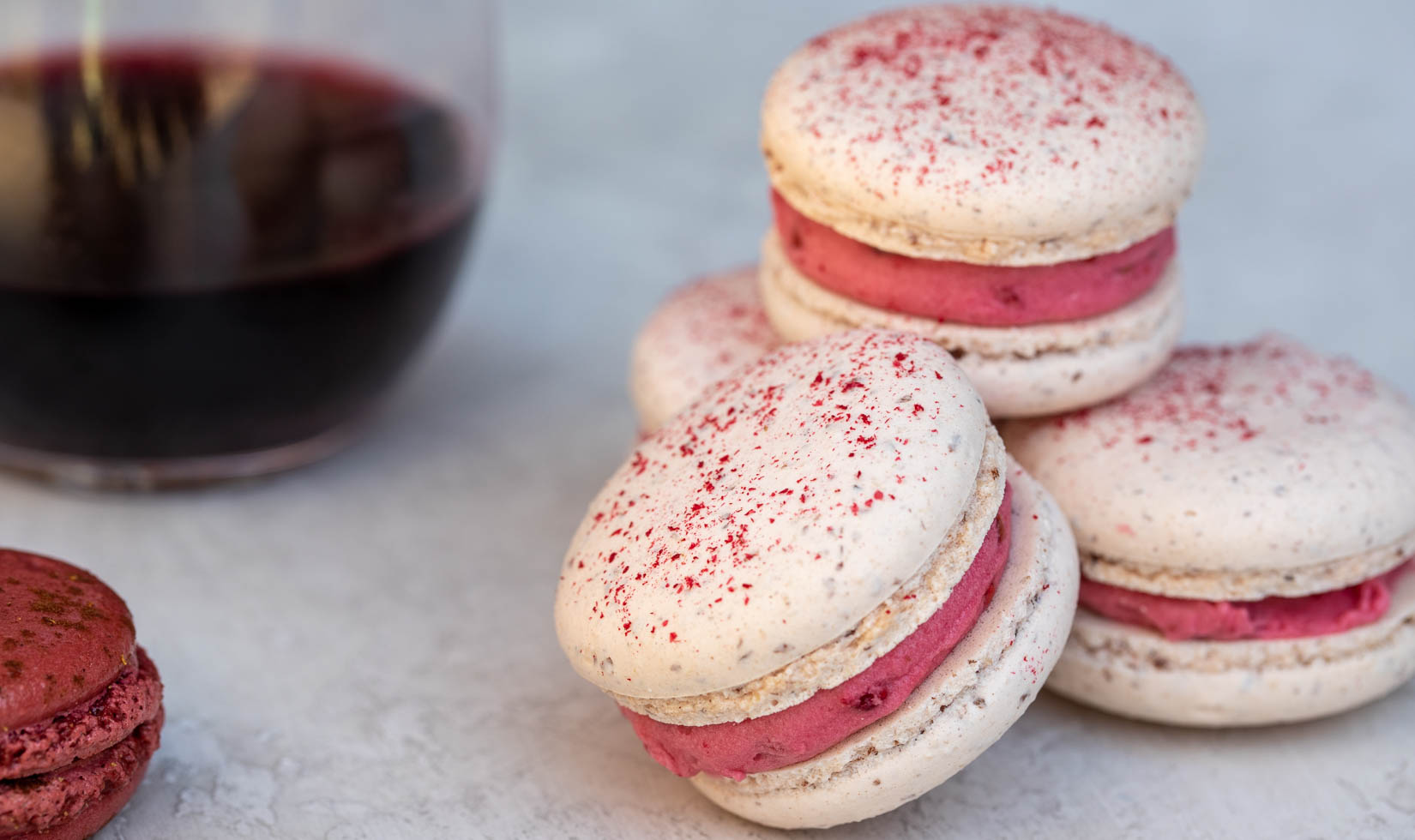 raspberry macarons cookies dessert with red wine