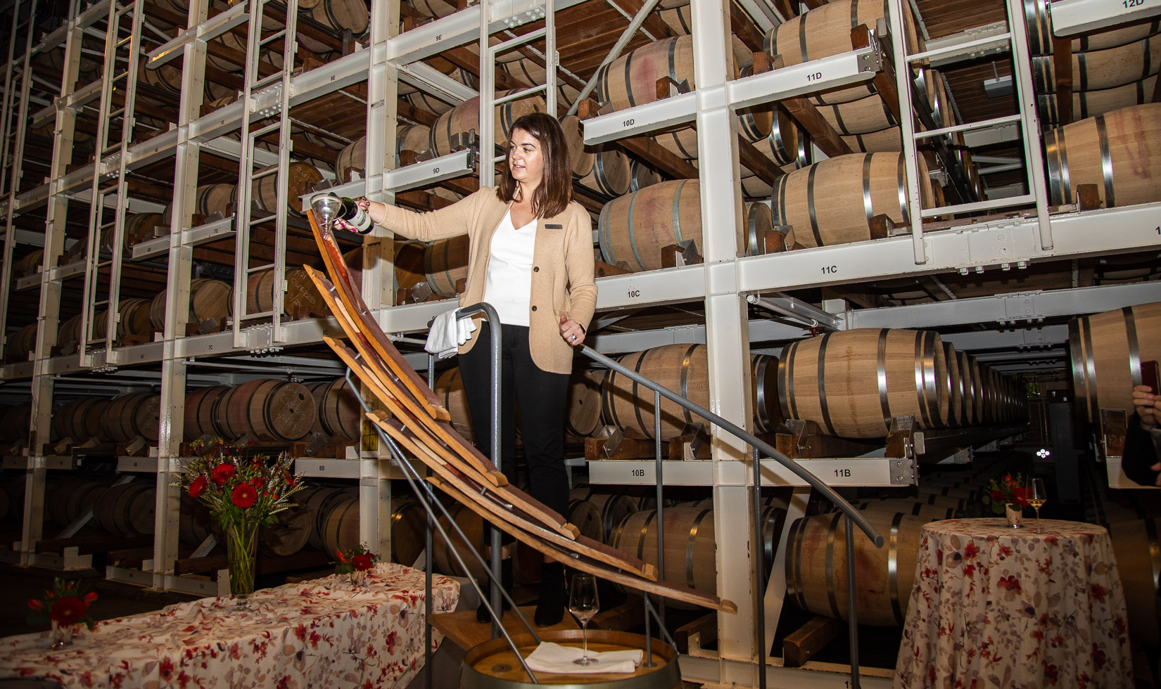 Jordan winemaker pouring from wine barrel luge