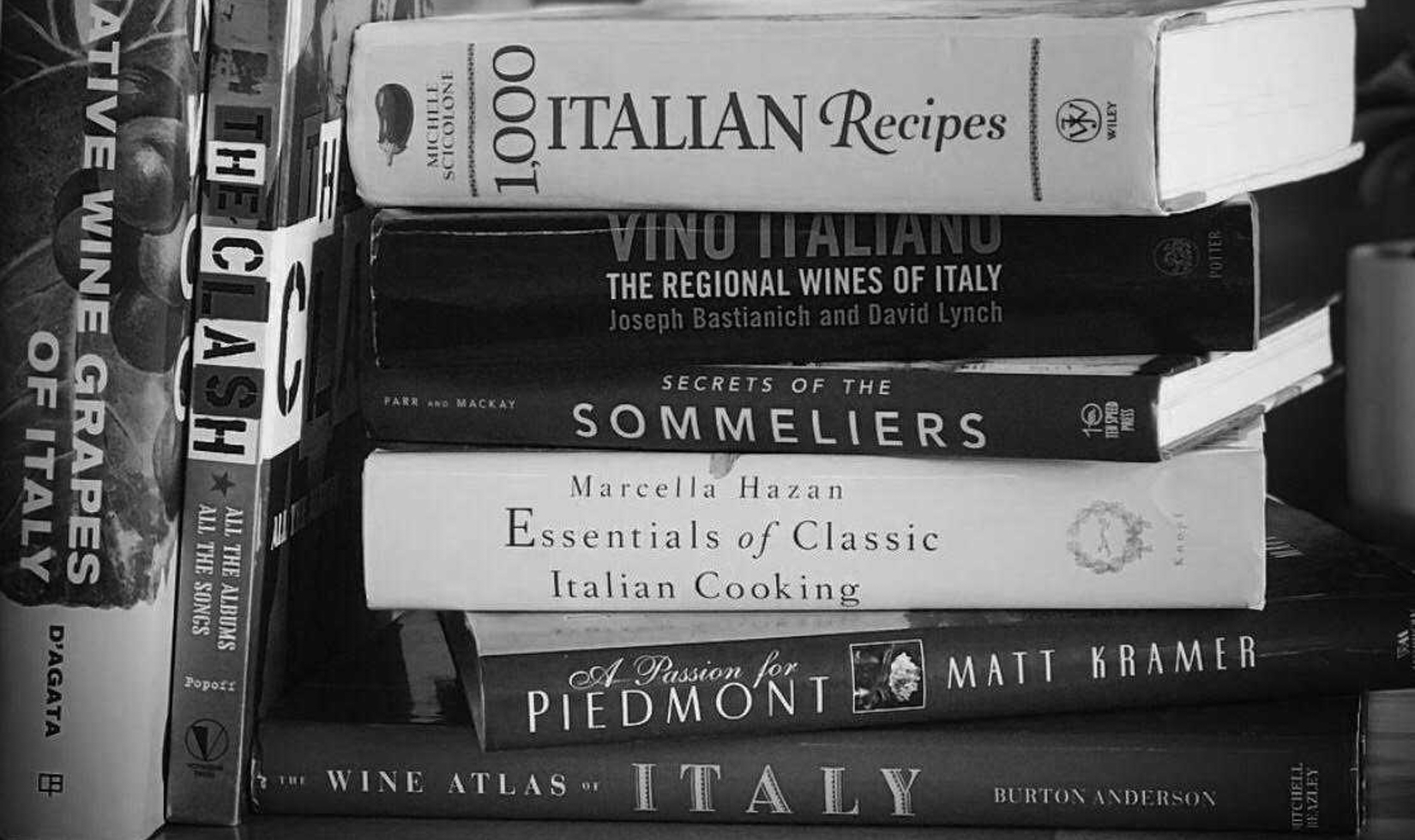 black and white photo of wine books stacked