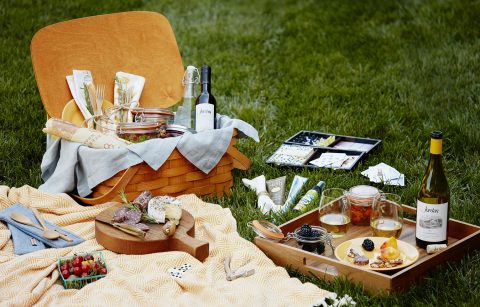 The ultimate picnic basket on the lawn with cheese, charcuterie, games and Jordan Chardonnay.