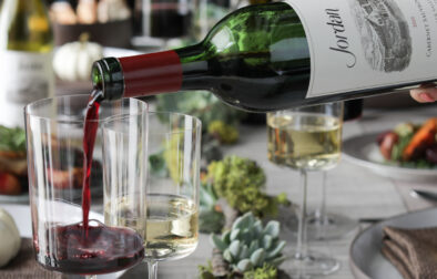 jordan winery thanksgiving table with cabernet sauvignon wine pouring into a glass
