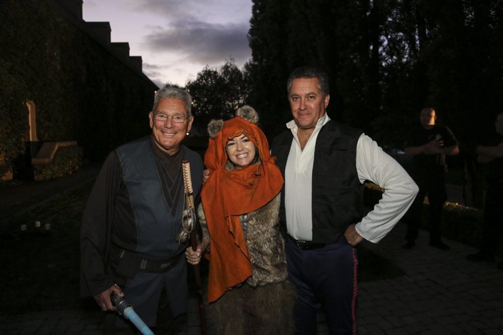 Guests dressed up for a Jordan Winery Star Wars Halloween party posing outside.