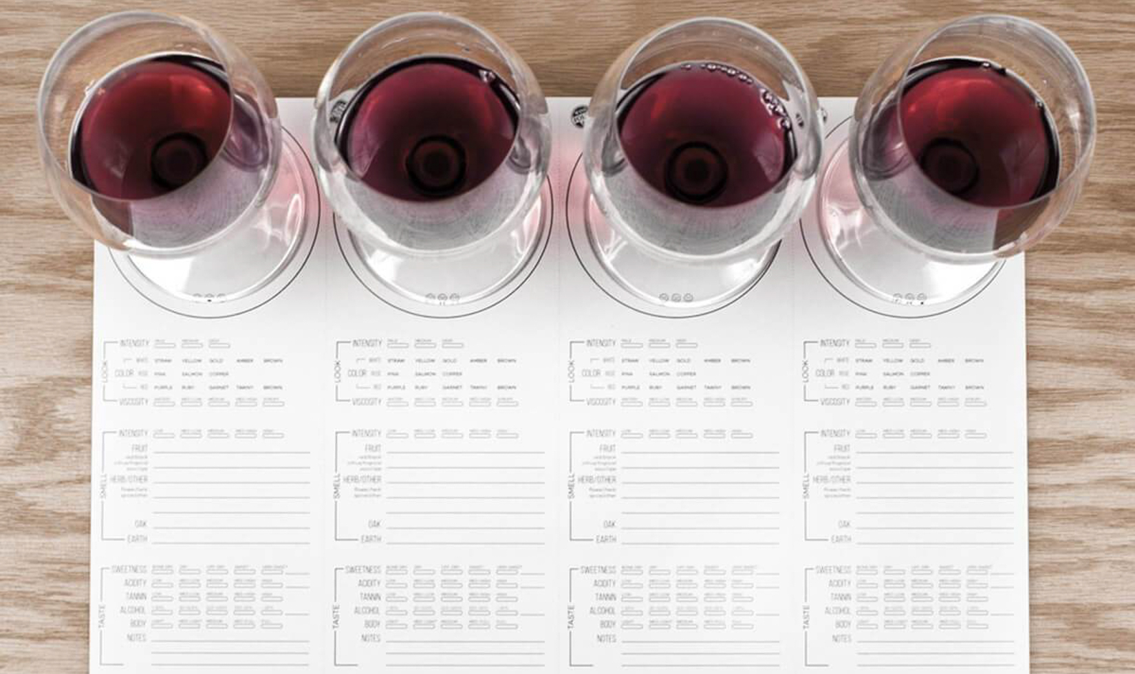wine tasting placemat with four red wine glasses
