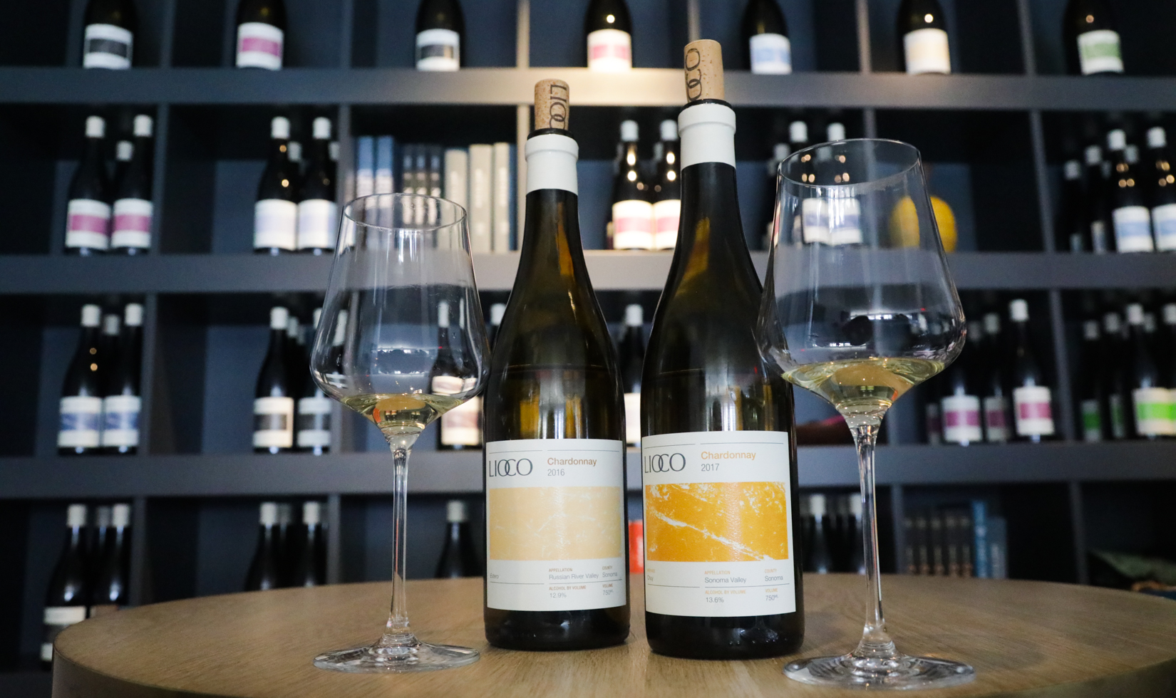two bottles of Lioco Chardonnay with wine glasses at Lioco Winery in Healdsburg
