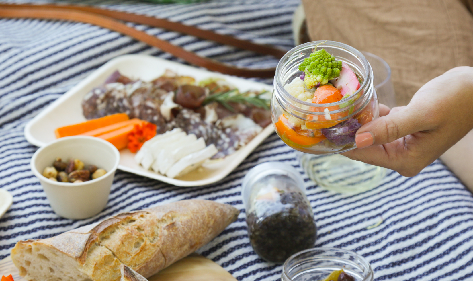 pickled vegetables in a glass jar for an outdoor picnic day at jordan winery