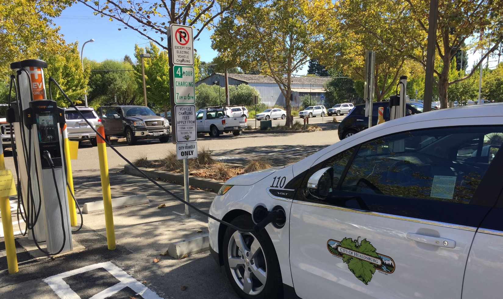 electric car plugged into charger in healdsburg public parking lot