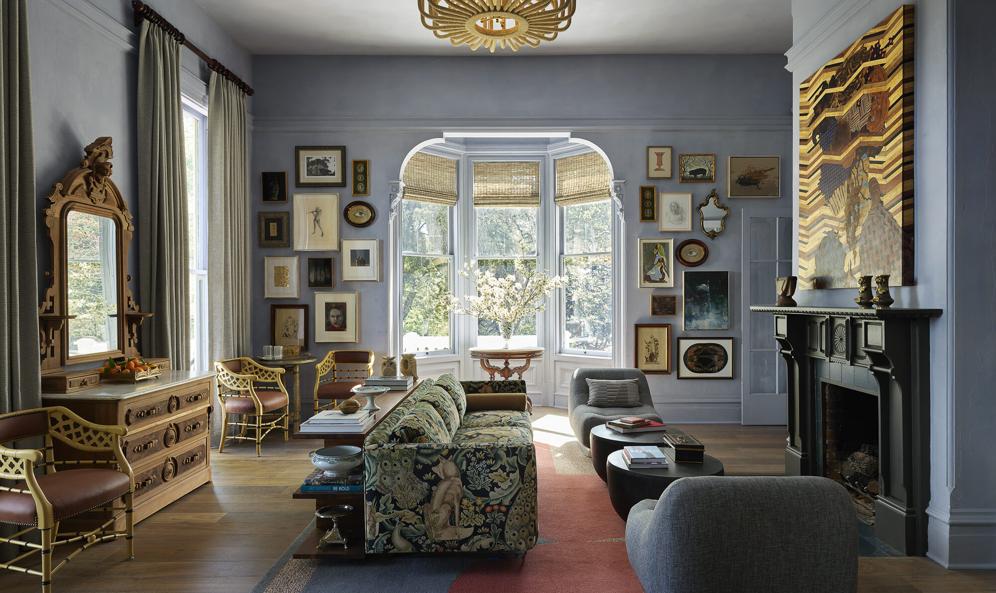 interior of the lounge at the madrona featuring eclectic mix of sofas, chairs and artwork in the victorian room