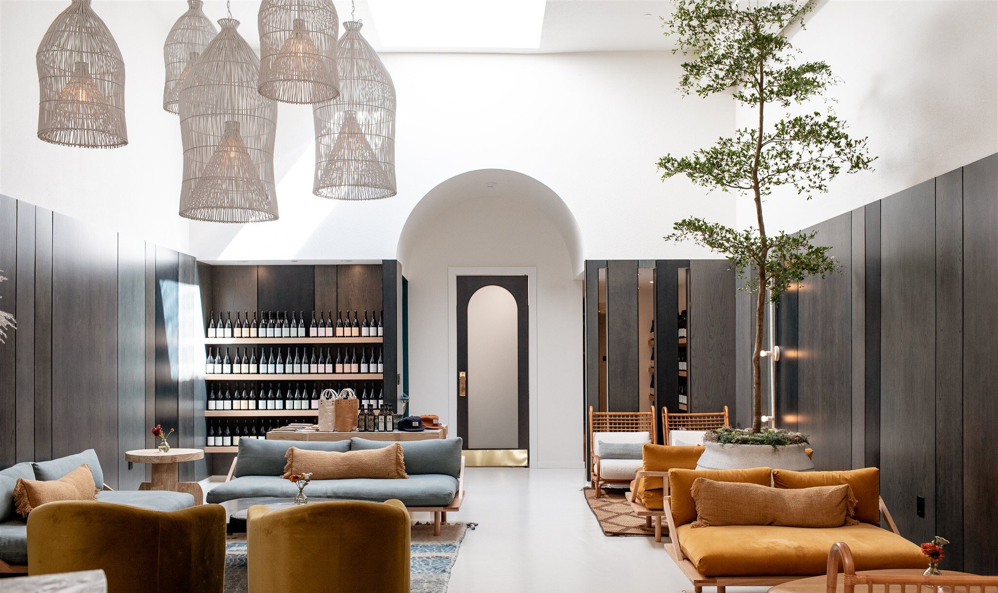 image of the interior of tasting room featuring fishing basket light fixtures hanging from the ceiling