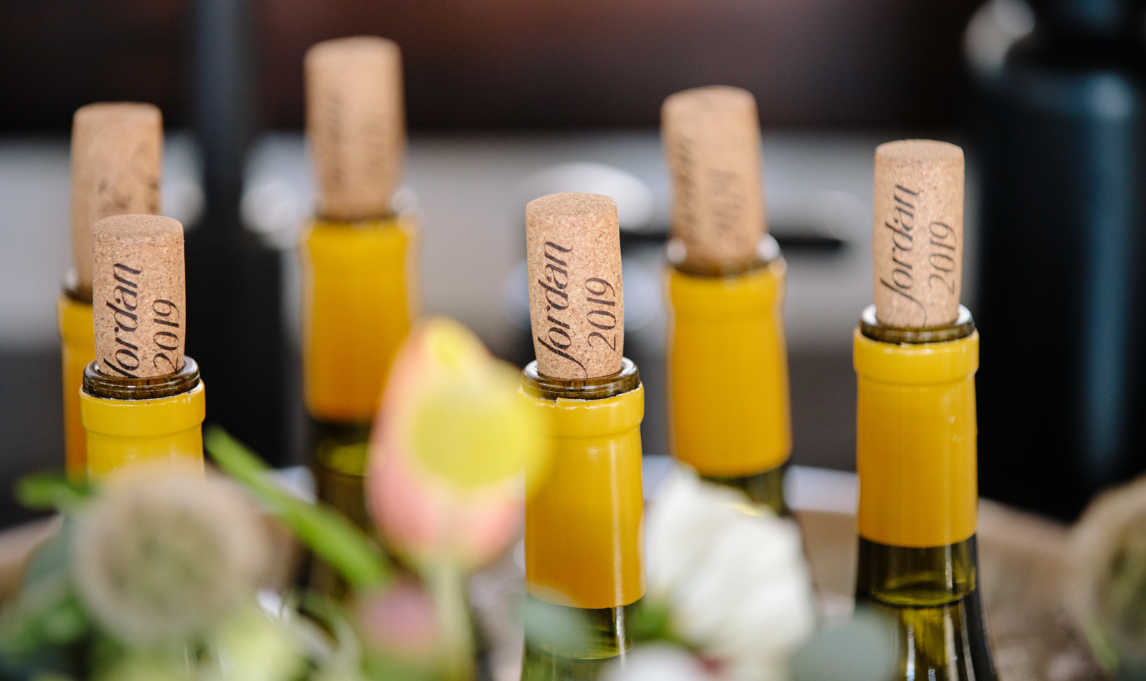 corks of chardonnay bottles lined up next to each other