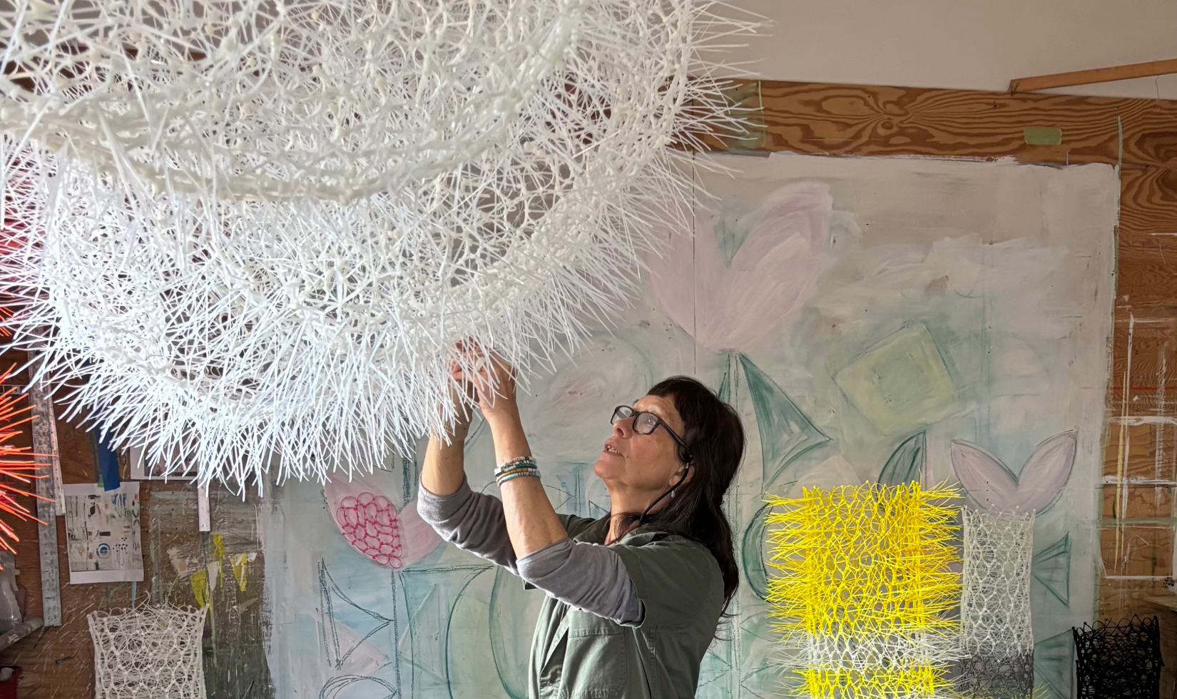 Artist working on 3D sculpture in studio